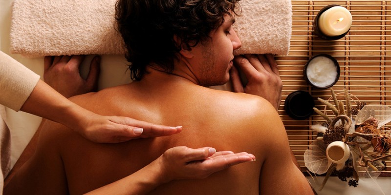 young guy in a beauty salon getting massage