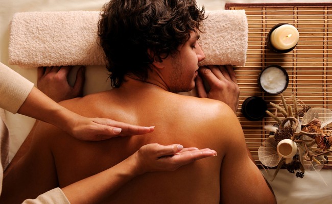 young guy in a beauty salon getting massage