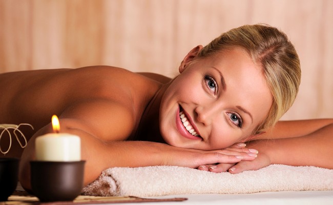 beautiful smiling female lying down in beauty salon
